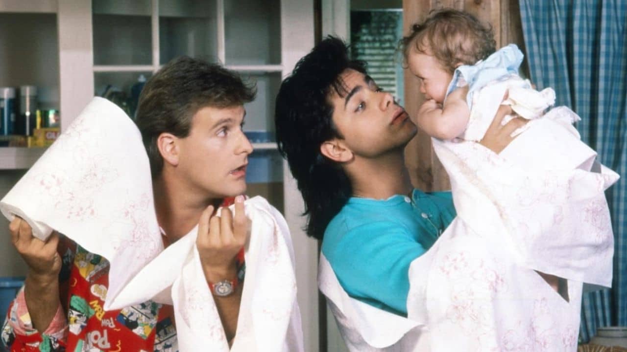 Ashley Olsen, Mary-Kate Olsen, John Stamos, and Dave Coulier in Full House (1987).
