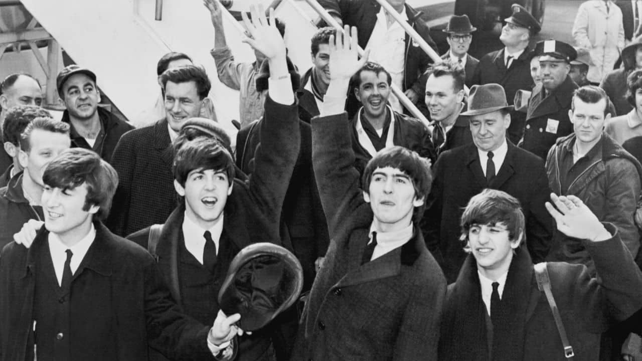 The Beatles arriving at the airport