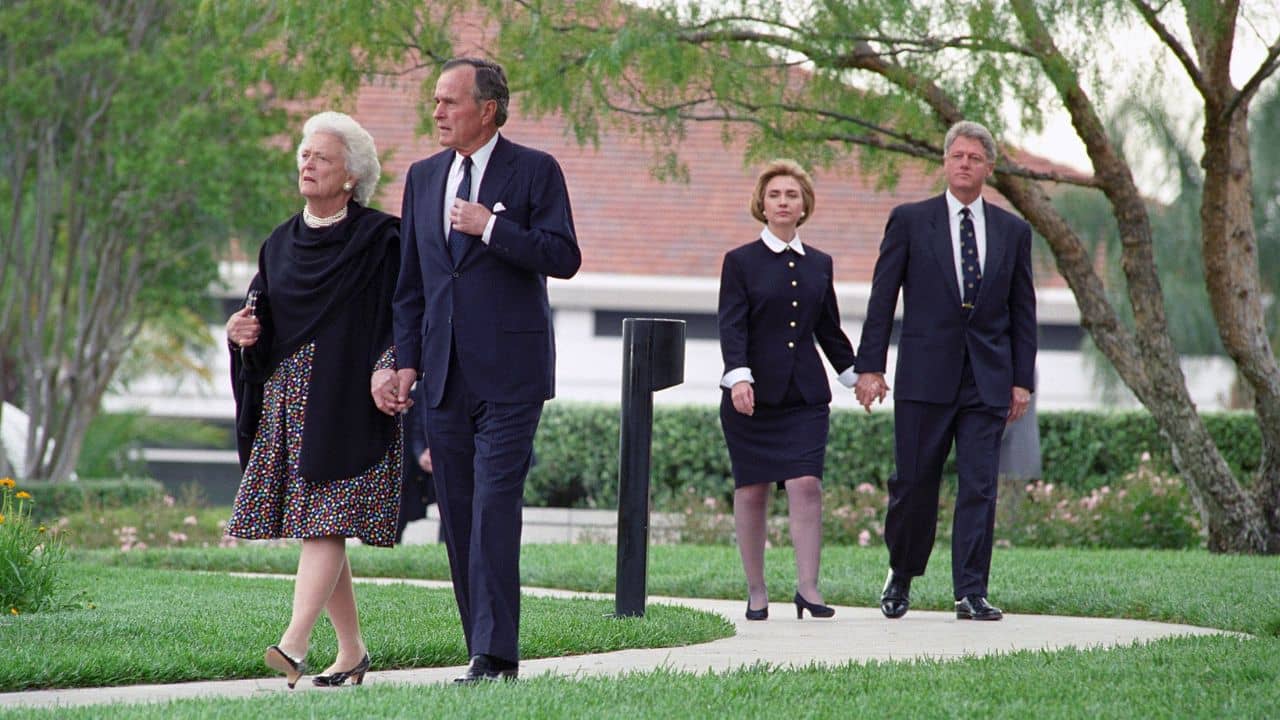 President Bill Clinton and First Lady Hillary Rodham Clinton, George H.W. Bush, and Barbara Bush walk in procession to former President Nixon's funeral ceremony.