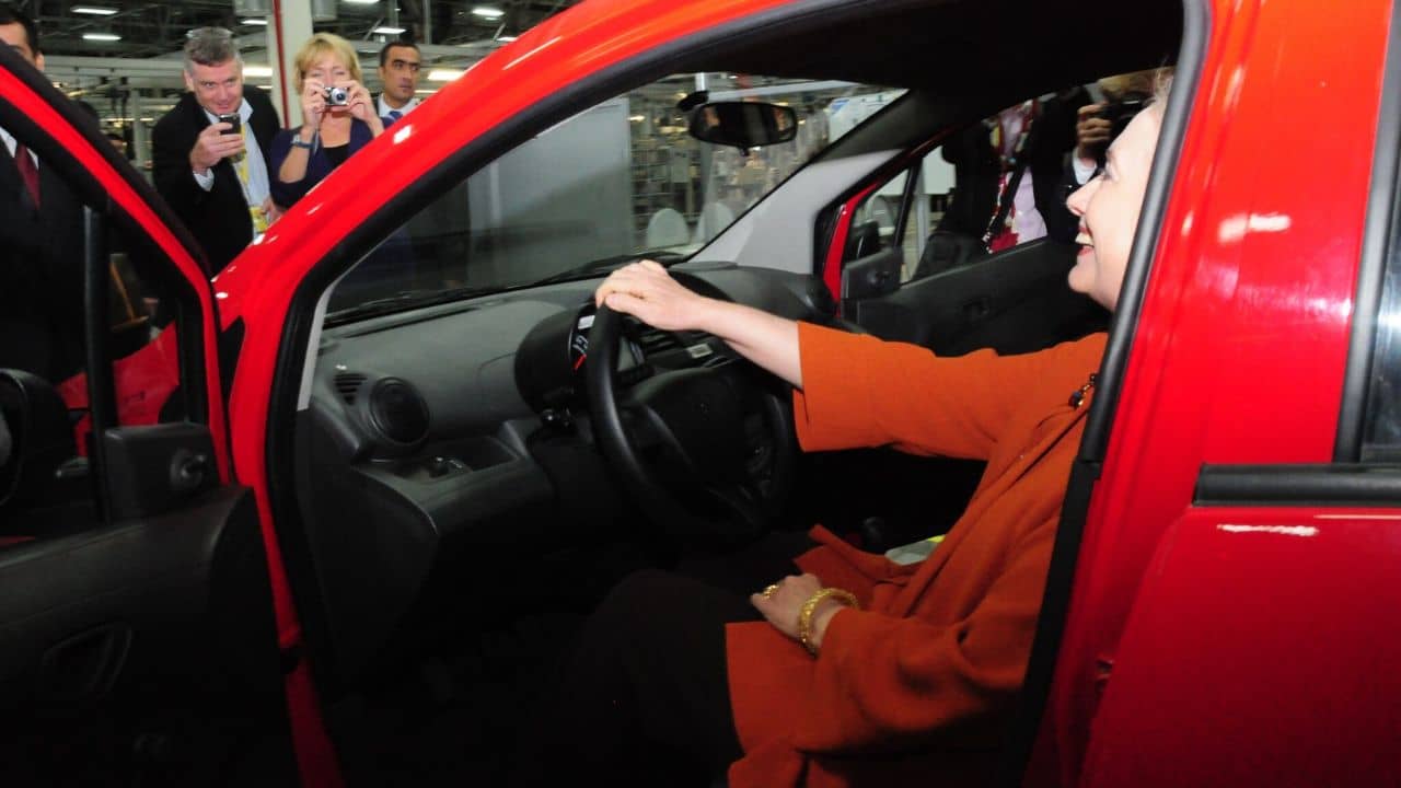 U.S. Secretary of State Hillary Rodham Clinton sits behind the wheel of a new Chevrolet Spark at the General Motors (GM) factory in Tashkent, Uzbekistan, on October 23, 2011.