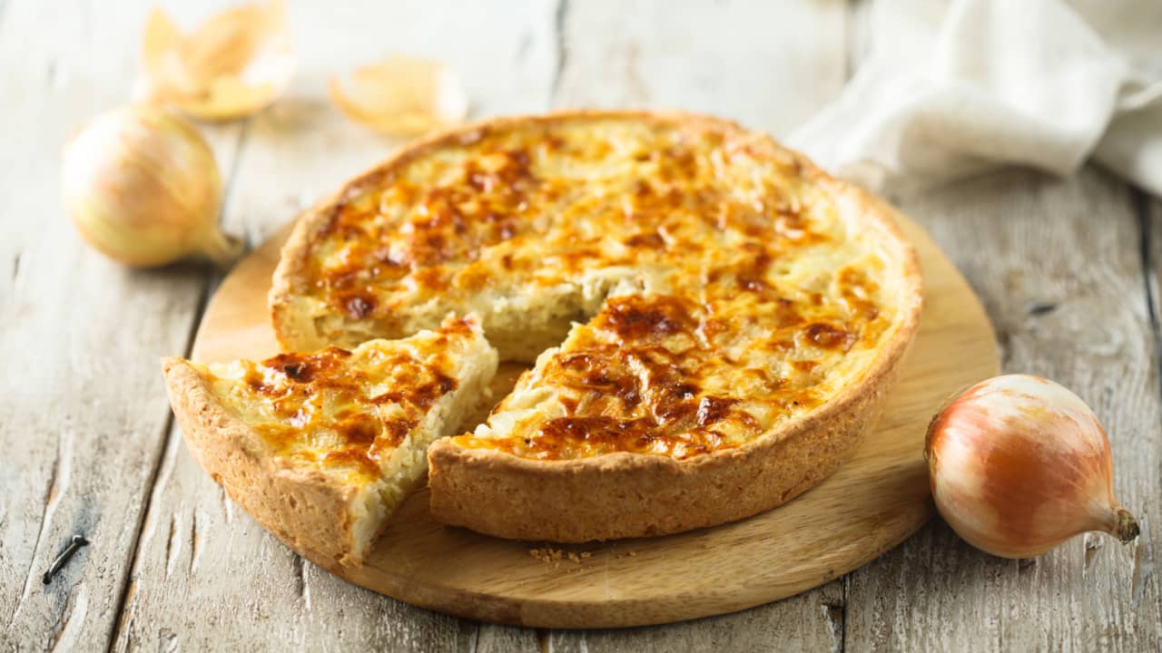 Quiche Lorraine presented on a table.
