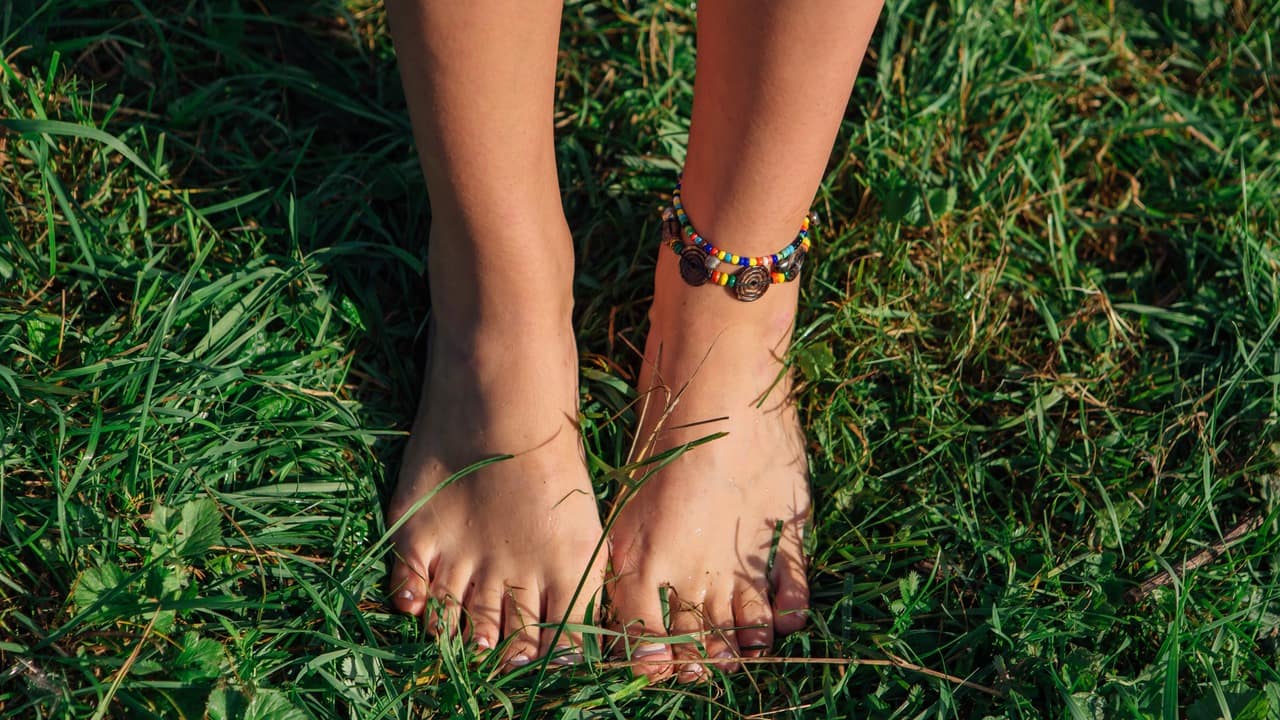 Bare feet in the grass.