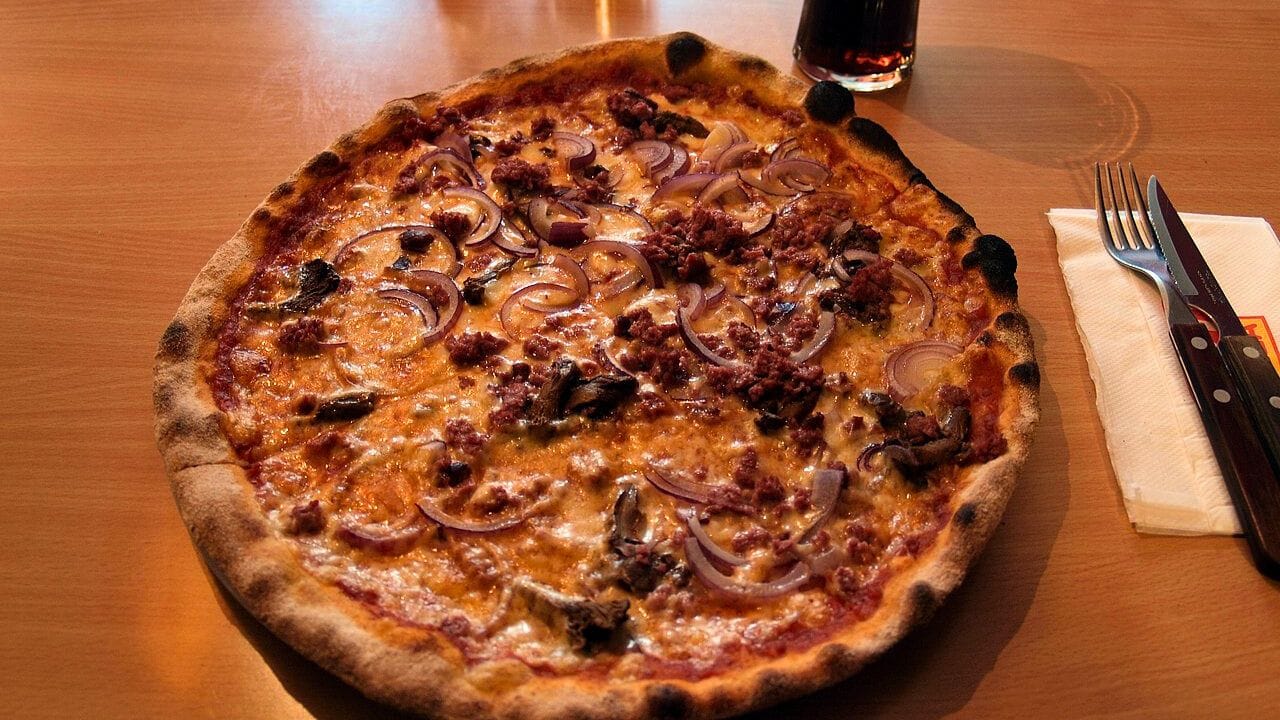 Pizza Berlusconi served at a Kotipizza restaurant in Lauttasaari, Helsinki, Finland.